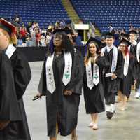 <p>The Class of 2016 from Fairchild Wheeler High marches into the Webster Bank Arena.</p>