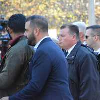 <p>Secret Service agents escort Hillary and Bill Clinton to a group of supporters after the pair cast their presidential votes in Chappaqua.</p>