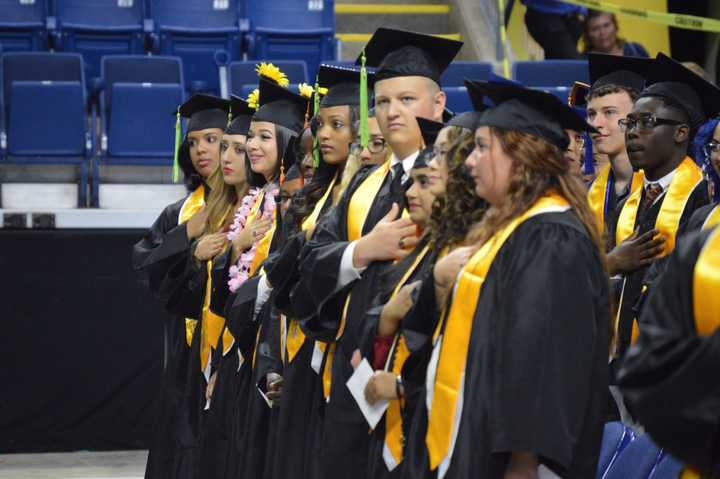 The graduates are all in a line from Fairchild Wheeler High in Bridgeport.