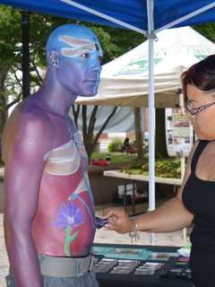 Stratford Artist's Painted Man Draws Crowds At Farmers Market