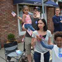 <p>Hillary Clinton supporters watch as the Democratic presidential candidate marches in her hometown parade in downtown Chappaqua.</p>