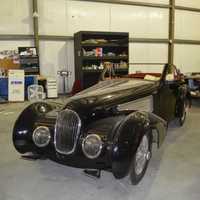 <p>Workers are putting the finishing touches on this vintage car at Redline Restorations in Bridgeport.</p>