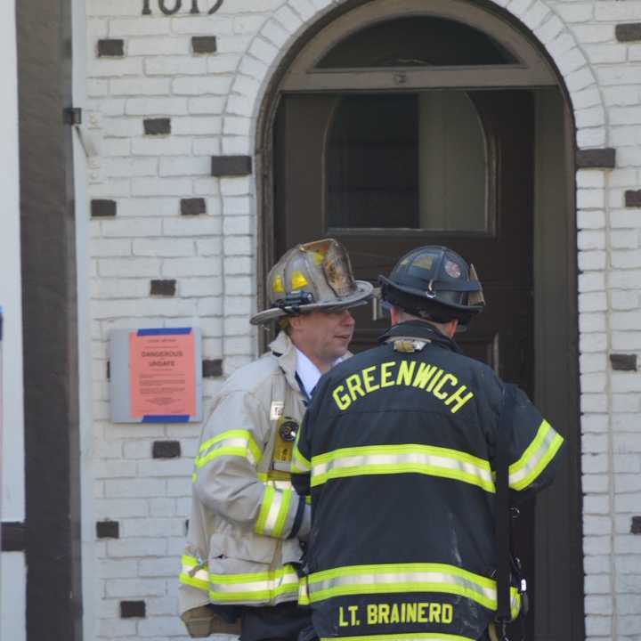 Firefighters extinguish a fire at Barcelona Wine Bar in Greenwich early Thursday morning.