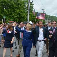 <p>Hillary Clinton, third from left, marches in downtown Chappaqua for the 2016 Memorial Day parade. Also pictured: Town Board members Lisa Katz and Adam Brodsky, Gov. Andrew Cuomo, Assemblyman David Buchwald and Councilman Jeremy Saland.</p>