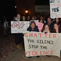 <p>Students gather outside at WestConn&#x27;s Midtown campus in Danbury. They walked around the quad chanting and waving signs to raise awareness to stop domestic and sexual abuse violence.</p>