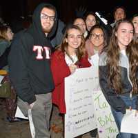 <p>Students gather outside at WestConn&#x27;s Midtown campus in Danbury. They walked around the quad chanting and waving signs to raise awareness to stop domestic and sexual abuse violence.</p>