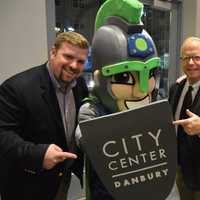 <p>Danbury Mayor Mark Boughton, Danbury Titans owner Bruce Bennett and the team mascot pose for a picture.</p>