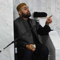 <p>Imam Muhammad Tahir delivering a sermon during Friday prayers at Masjid Al-Aisha in Bergenfield.</p>