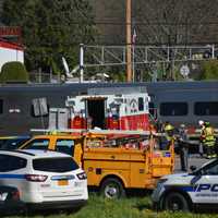 <p>Investigators are at the scene of a grade crossing in Bedford Hills. A train collided with a vehicle at the crossing on Wednesday.</p>