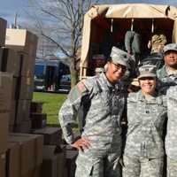 <p>Margarita Urgiles, center, of Wallington, and military members helped load gifts into trucks for the Bergen County PBA&#x27;s 27th Annual Toy Drive.</p>