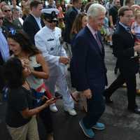 <p>Former President Bill Clinton marches in the town of New Castle&#x27;s 2016 Memorial Day parade, held in downtown Chappaqua. State Assemblyman David Buchwald, pictured at right, marches with his infant daughter.</p>