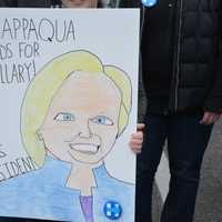 <p>A Hillary Clinton supporter displays a homemade fan poster of the Democratic presidential candidate. A large group of supporters gathered in Chappaqua for Clinton&#x27;s arrival at her polling place.</p>