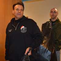 <p>Nicoletti leads Harrington Park Officer Jacob Miller and Oradell Officer Rich Liguori into the gift-holding room at the Sanzari Children&#x27;s Hospital last year.</p>