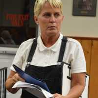 <p>Carol Woznicki of Emerson leaving the podium after urging the council not to renew the Just Pups license.</p>