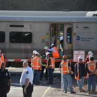 <p>Investigators are at the scene of a grade crossing in Bedford Hills. A train collided with a vehicle at the crossing on Wednesday.</p>