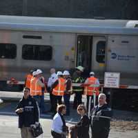 <p>Investigators are at the scene of a grade crossing in Bedford Hills. A train collided with a vehicle at the crossing on Wednesday.</p>