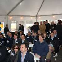 <p>A packed crowd gathers under a tent to hear remarks prior to a groundbreaking at Chappaqua Crossing.</p>