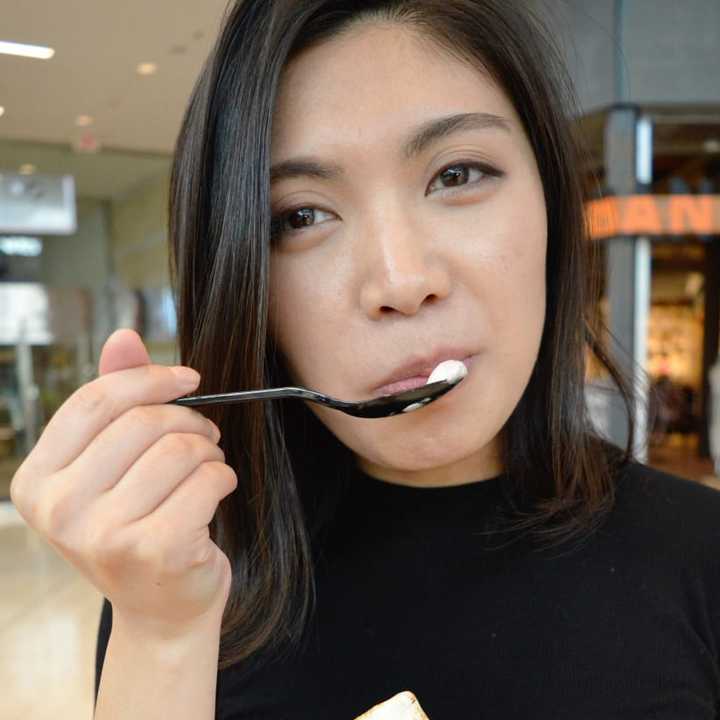 Rachel Chan enjoying a Classic S&#x27;more ice cream treat from Rolling Cow.