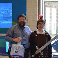 <p>Rabbi Levi Stone and &quot;Judah Maccabee&quot; pose near the Maritime Aquarium&#x27;s menorah Friday.</p>