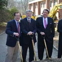 <p>Summit Development President Felix Charney, center, poses for photos with his project team, who have helped him over the years with multiple proposals for the site.</p>