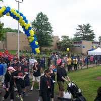 <p>Walkers head toward the track at Albertus Magnus HS Sunday morning.</p>