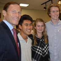 <p>U.S. Sens. Richard Blumenthal, left, and Chris Murphy, right, pose with Fairfield Warde High School seniors Peter Hwang, Jacqueline Kaiser and Max Lee at a Domestic Violence Awareness Month roundtable in Fairfield.</p>