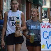 <p>Ramsey&#x27;s Olivia Manzo, Rebecca Schachtel, and Sarah Welsh take a Starbucks break while helping advertise a car wash at the high school.</p>