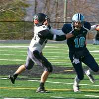 <p>Westlake QB Thomas Castro stiffarms a defender Saturday.</p>