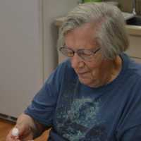 <p>Administrative volunteer Micheline Hodge at work in the kitchen.</p>