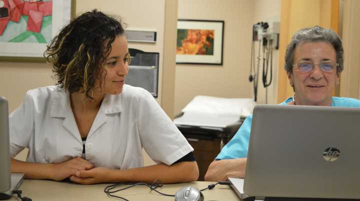 Laura Franco Zapata, volunteer interpreter, left, and Nancy Baker, volunteer registered nurse, at Bergen Volunteer Health Initiative.