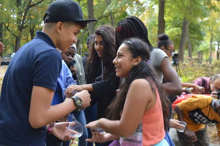 Students from Bridge Academy and Park City Prep School released brook trout into the Pequonnock River Thursday.