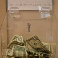 <p>Patients with no medical insurance who receive free healthcare at the Bergen Volunteer Medical Initiative often leave a little money in the lobby to contribute what the can.</p>