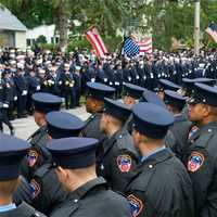 <p>Thousands of firemen, NYPD, public officials and civilian attendees lined the streets around the Church of the Annunciation to mourn FDNY Battalion Chief Michael Fahy, killed Tuesday in a Bronx building explosion.</p>