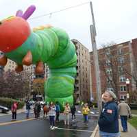 <p>Volunteers practice corralling The Very Hungry Caterpillar at Latham Park Monday.</p>