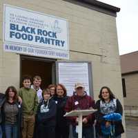 <p>Volunteers serve families each weekend at the Black Rock Food Pantry in Bridgeport.</p>