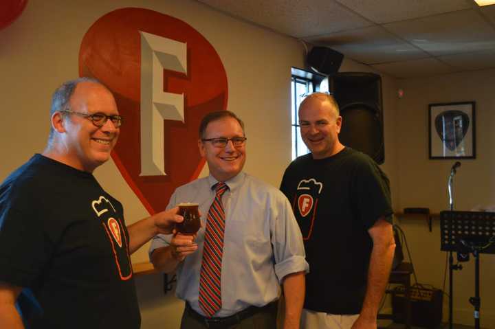 Mike Borruso, Stratford Mayor John Harkins and Joe Bow celebrate the opening of Fairfield Craft Ales.