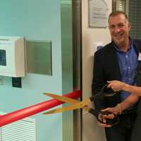 <p>Cliff LaMatta and Jodee Noval cut the ribbon at one of the operating suites.</p>