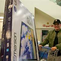 <p>This man is all smiles after finding his big-screen TV on Black Friday.</p>