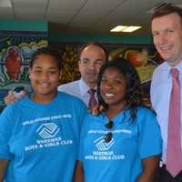 <p>U.S. Sen. Chris Murphy, second from right, and Bridgeport Mayor Joe Ganim, second from left, pose with members of the Smilow-Burroughs Clubhouse in Bridgeport.</p>