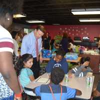 <p>U.S. Sen. Chris Murphy talks with kids at the Smilow-Burroughs Clubhouse in Bridgeport.</p>