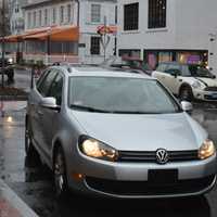 <p>A car pulls up to the valet parking station outside Bedford Square on a rainy Thursday in downtown Westport.</p>