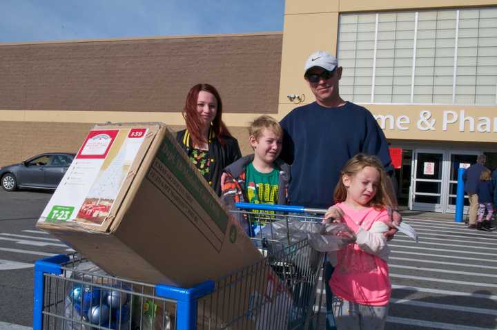 Heading for the car with a cart full of goodies.