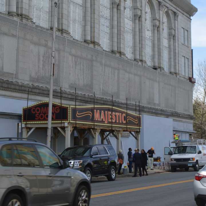 City leaders gather under a new marquee for the shuttered Majestic Theater in Bridgeport.