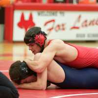 <p>Jake Witz of Fox Lane (top) controls Trent Stafford of Byram Hills Wednesday at Fox Lane HS.</p>