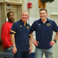 <p>Mahopac Head Coach Dennis DiSanto (L) and Mahopac coaches watch the action.</p>