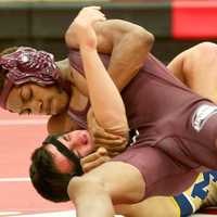 <p>Ossining&#x27;s Clayton Francees (top) controls Alex Rabinowitz of Mahopac in a 120-pound bout.</p>