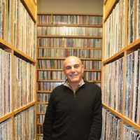 <p>General Manager Steve di Costanzo stands amid the canyons of records ready to be played at WPKN-FM of Bridgeport.</p>