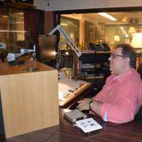 <p>Rob Silber prepares for a Saturday show at WPKN in Bridgeport.</p>