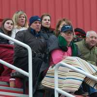 <p>Fans watch the chilly lacrosse season opener Thursday at Fox Lane.</p>