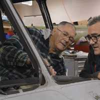 <p>Charlie Vesterman and Tim Benson work on an aircraft at the Connecticut Air and Space Center.</p>